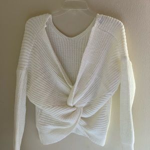 White wool oversized sweater with twisted back.